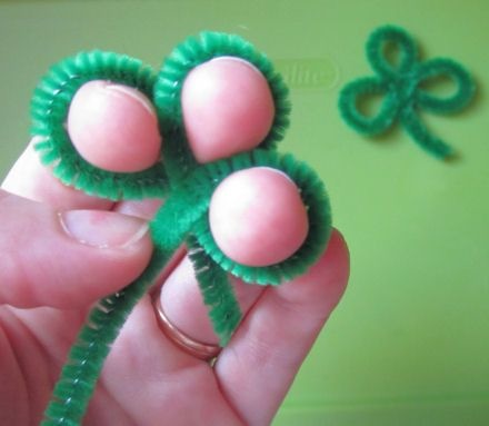 Use three fingers and a green pipe cleaner to create a St. Patrick's Day shamrock.